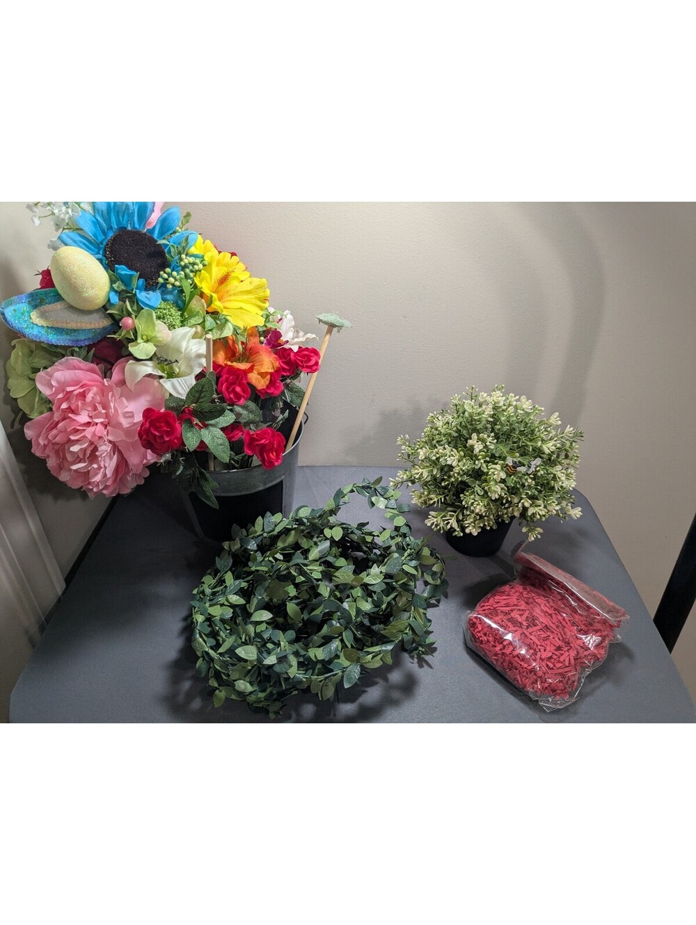 Artificial Flower Arrangement with Decorative Greenery and Shredded Paper Filler